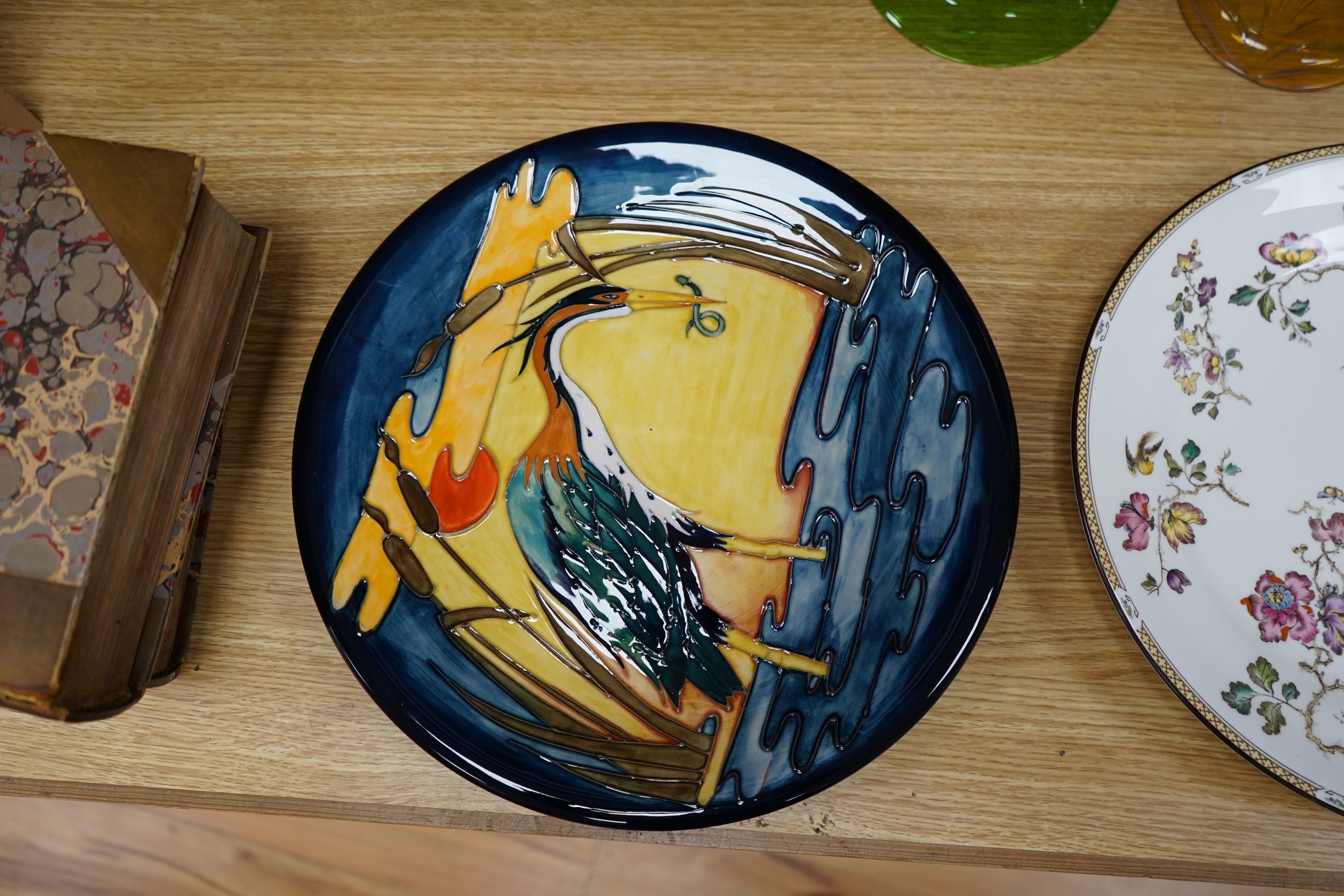 A Moorcroft Heron design wall plate, signed and dated 19.8.87 to the base, together with a Wedgwood ‘Swallow’ plate, largest 36cm in diameter. Condition - good